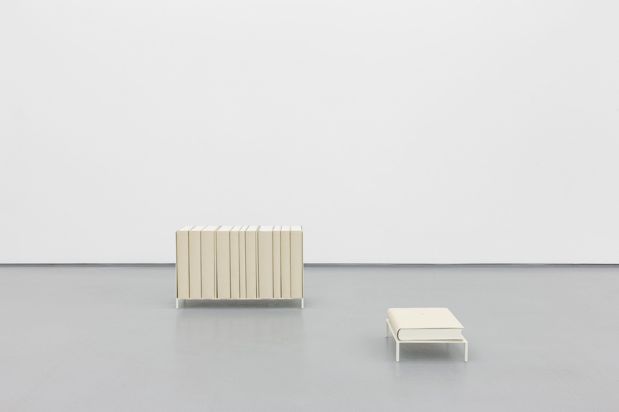 Daniel Gustav Cramer, Sand, 2021. Shelf, table, 14 books. 103 × 91 × 32.5 cm
