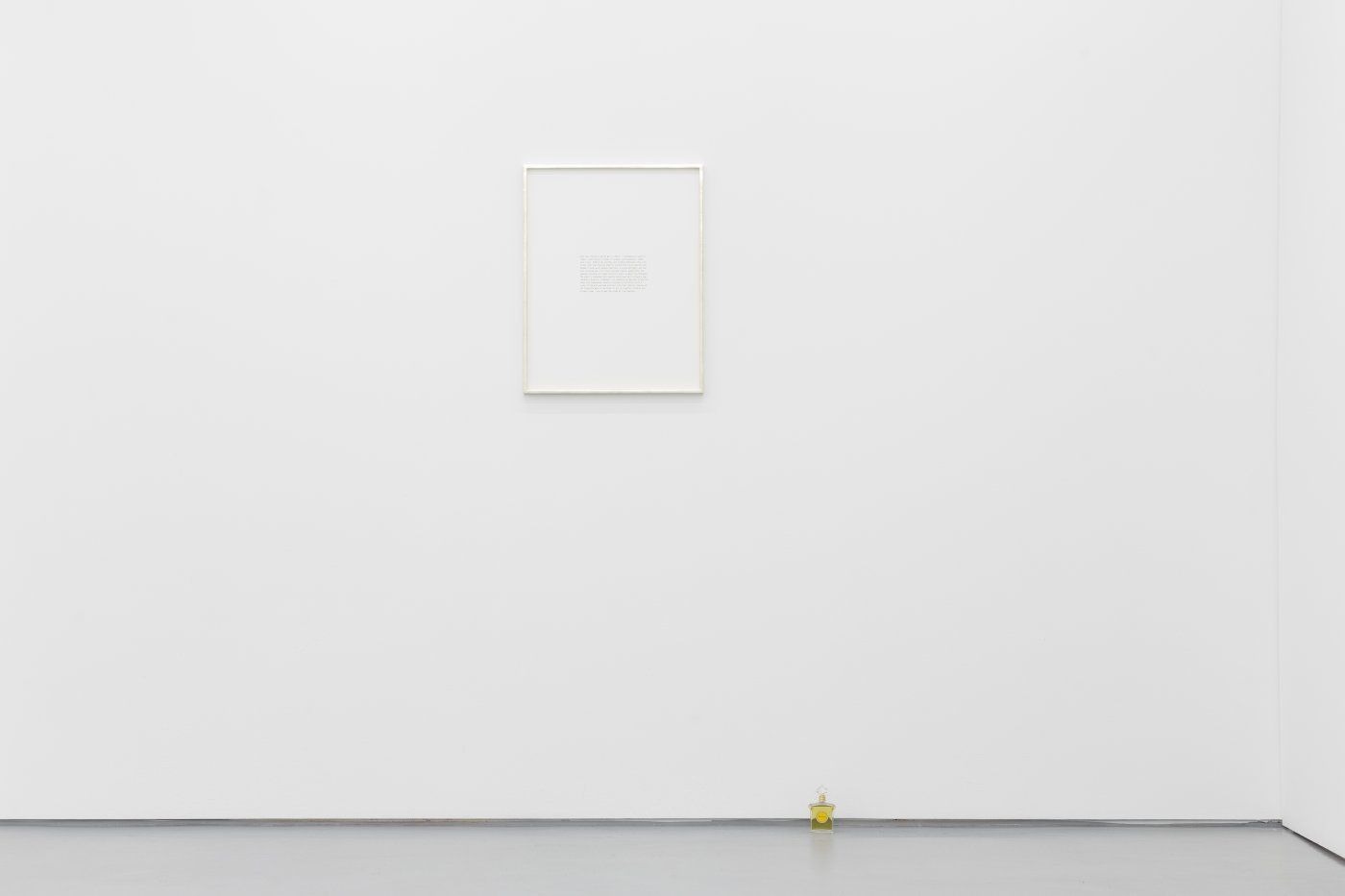Daniel Gustav Cramer, Charlie, 2021. Text, plated gold frame, several bottles of Mitsouko eau de parfum by Guerlain. 61 × 48 cm
