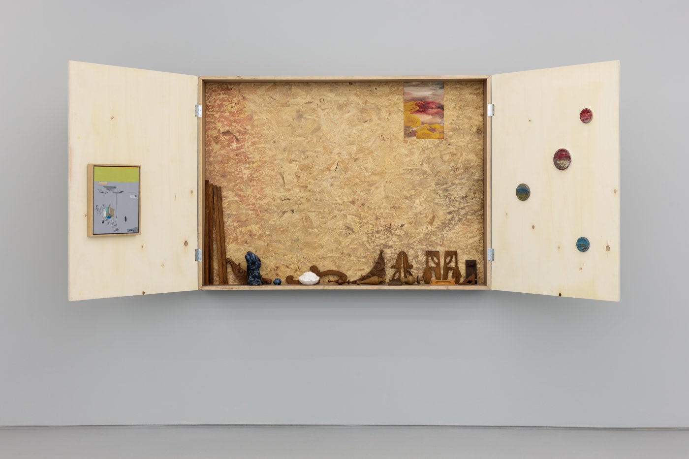 Susanne S. D. Themlitz, Inside. Perhaps., 2019-2022. Plaster, ceramics, wood and oil, charcoal, graphite on acrylic on canvas, on wood and on metal caps. 110 x 300 x 17 cm (open). Unique
