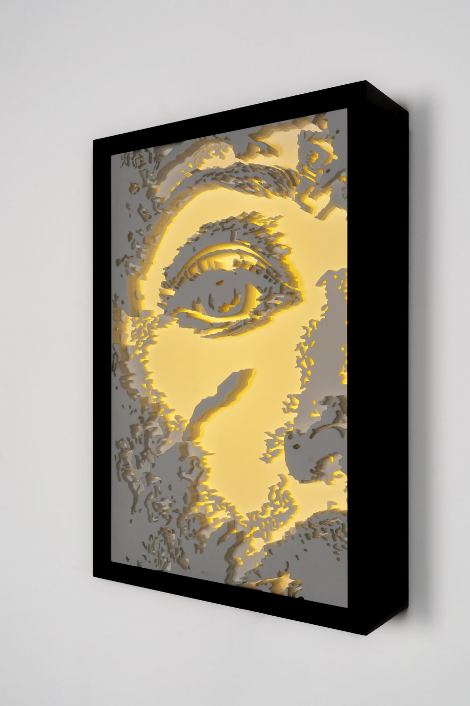 Alexandre Farto aka Vhils, Glimmer series #02, 2022. Water jet cut Corian, assembled by hand, led lights. 79,5 x 53,5 x 17 cm. Unique
