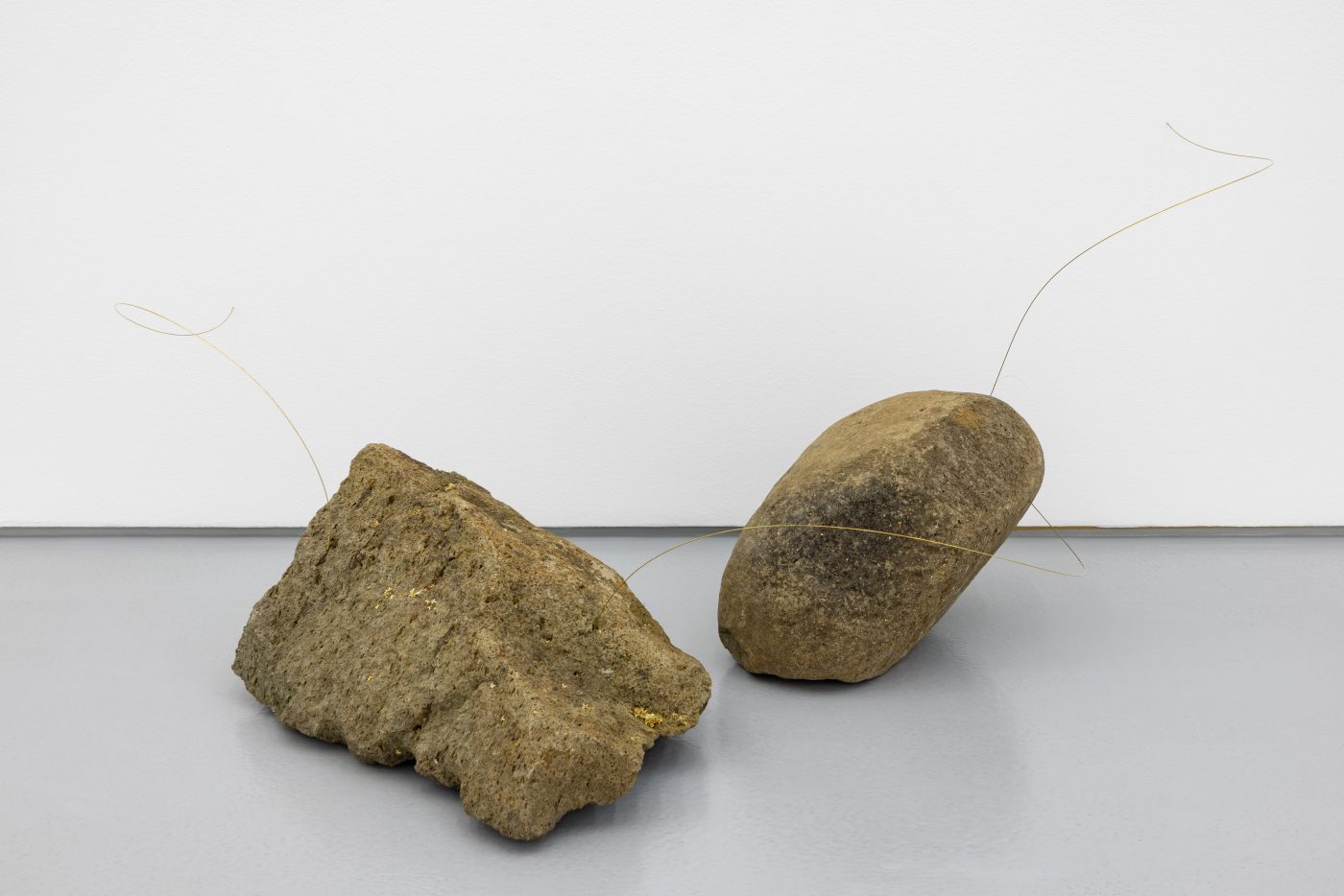 Joana Escoval, pulse, 2025. Magmatic rocks, brass, horse hair, olive blossoms, lichens. 60 x 140 x 103 cm. Unique
