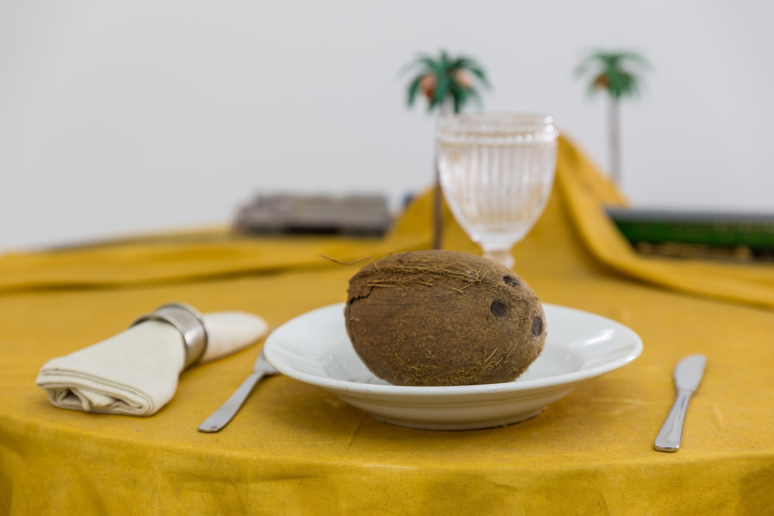 Ana Vieira, Mesa-Paisagem (detail), 1973. 94 x Ø 110 cm.  Wooden table, fabric, spray paint on fabric, metal, ceramics, and objects (1 plate, cutlery, napkin ring, napkin, sand, boat).Unique
