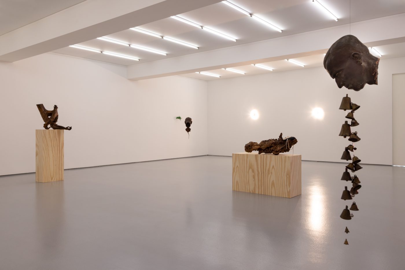 André Romão, Via Lactea, 2026. Sculptural fragment (patinated terracotta, Italy ,1930’s), bells. 93 x 17 x 20 cm
