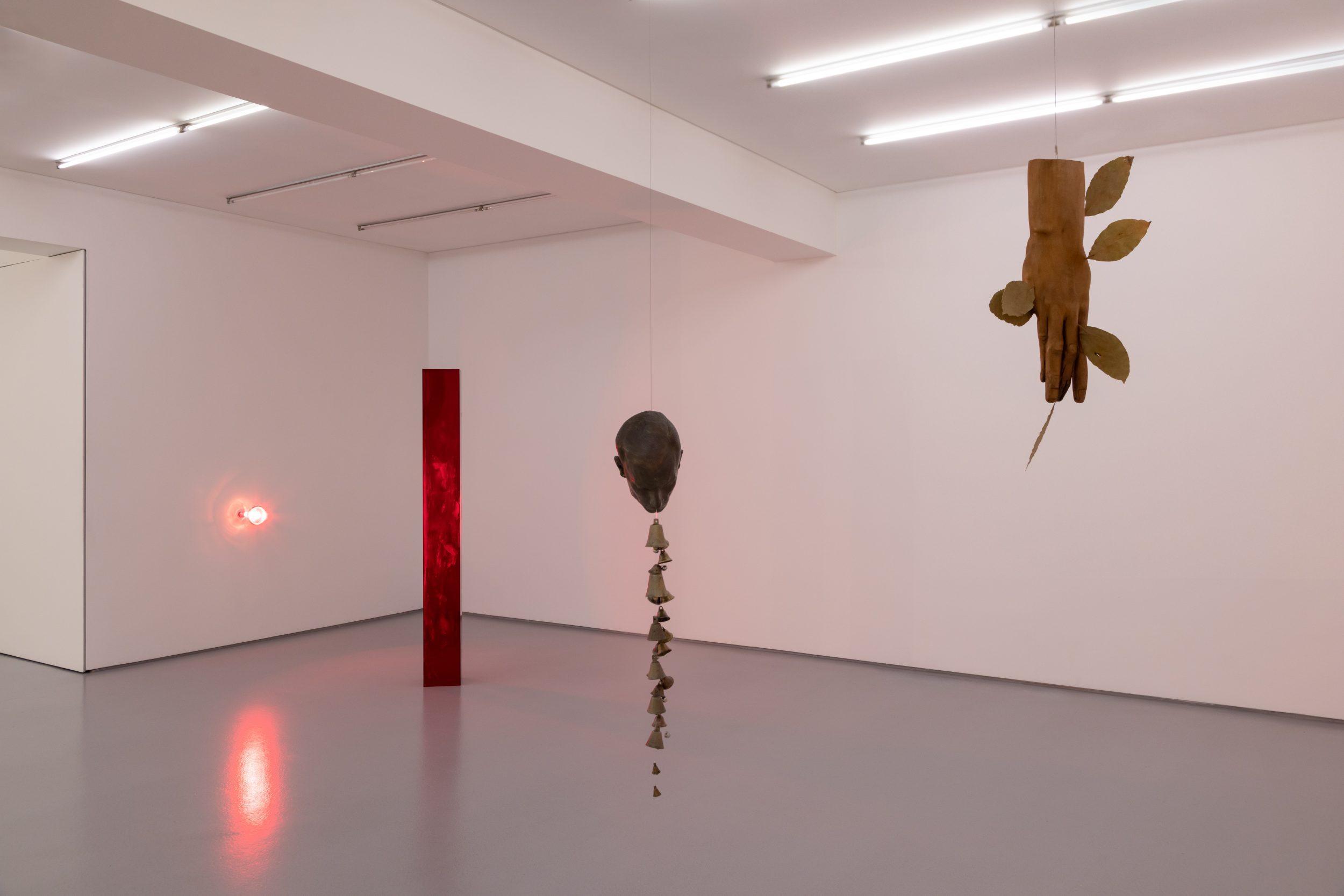 André Romão, Via Lactea, 2026. Sculptural fragment (patinated terracotta, Italy ,1930’s), bells. 93 x 17 x 20 cm
