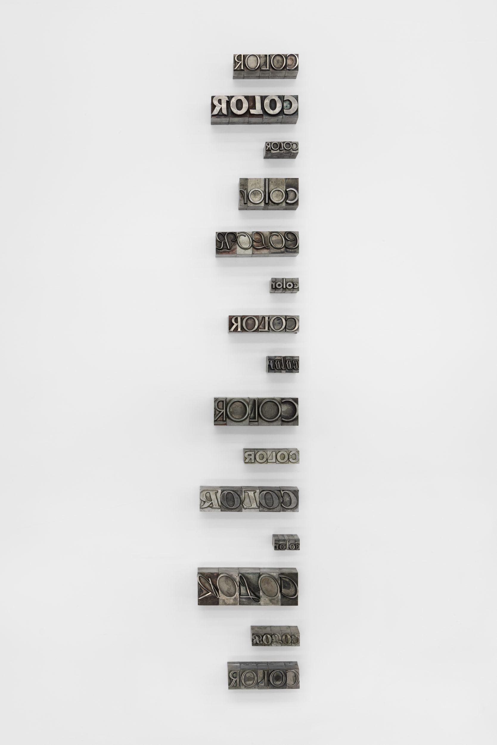 Ignasi Aballí, Color, 2025. Lead fonts on wall. 50 x 8,5 x 2,5 cm.

