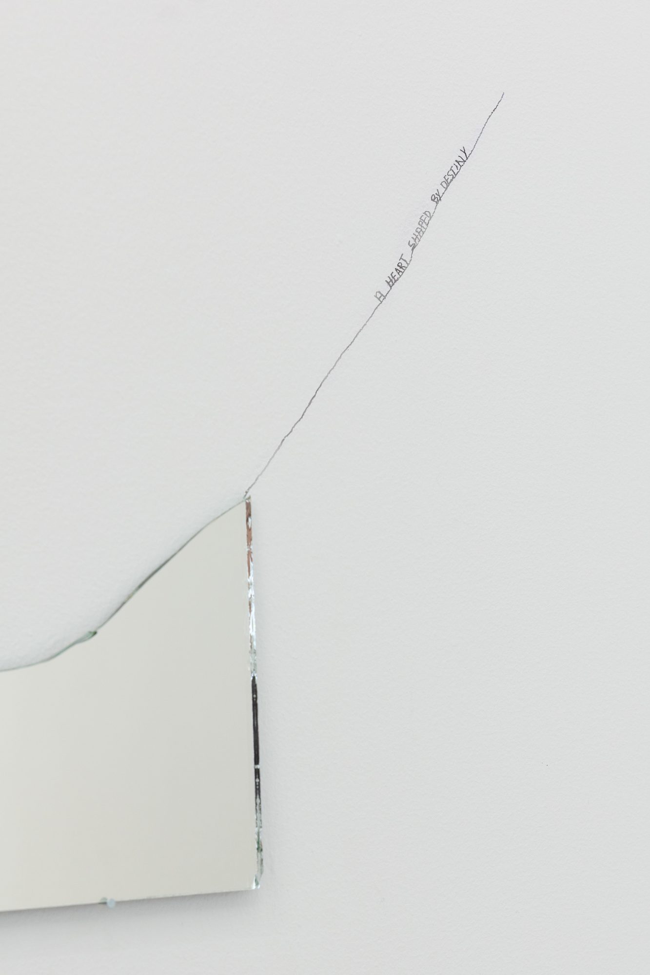 Charbel-joseph H. Boutros, A heart shaped by destiny (detail), 2025-2026. Broken mirror, nails, drawing on wall, destiny. 10 x 30 cm
