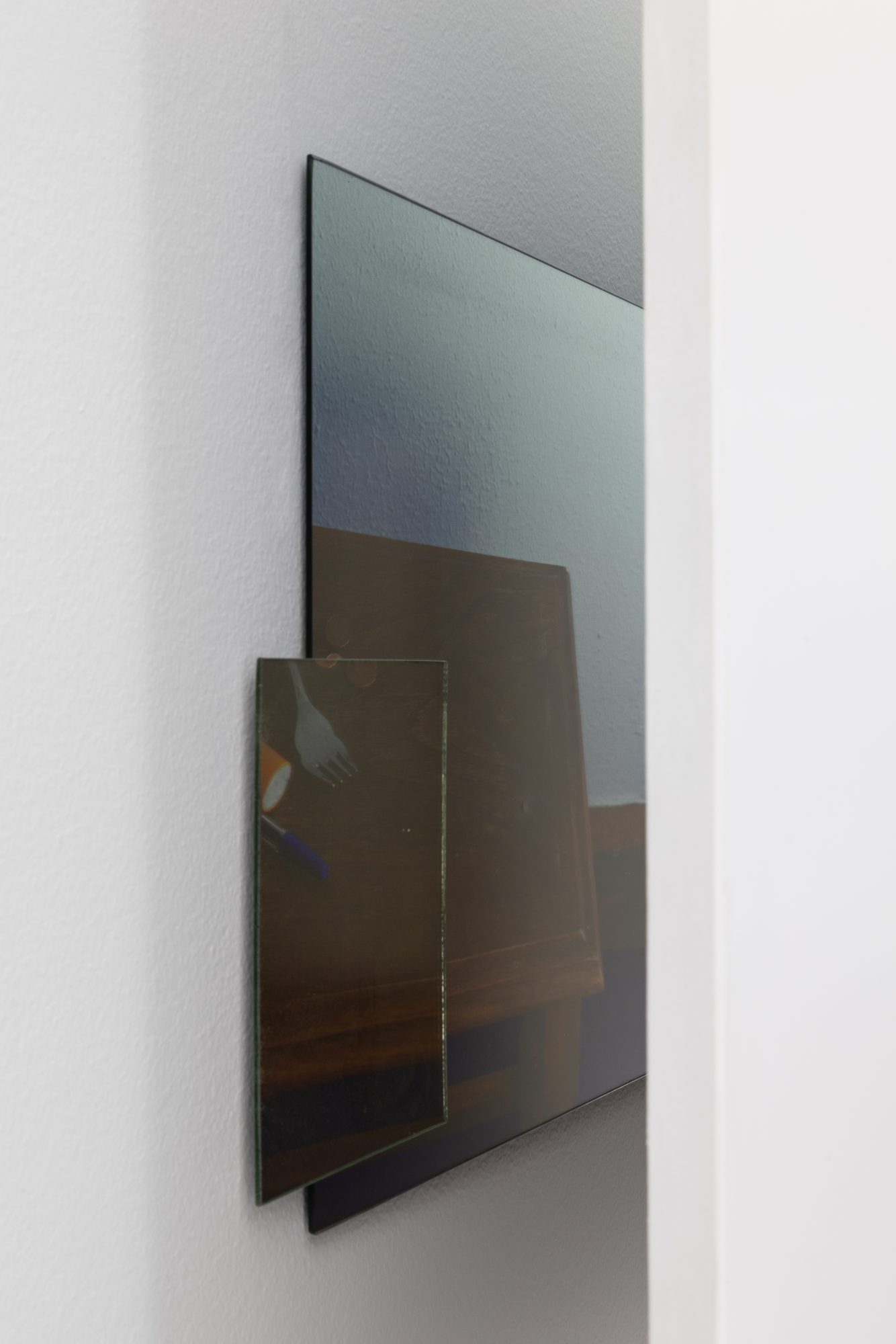 Ana Vieira, Close Up (11), 2004. White panel, photograph, mirrors, and metal cables
