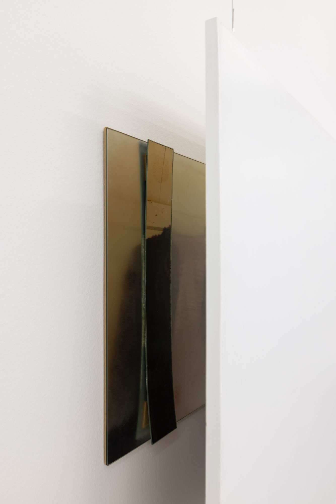 Ana Vieira, Close Up (03), 2004. White panel, photograph, mirrors, and metal cables