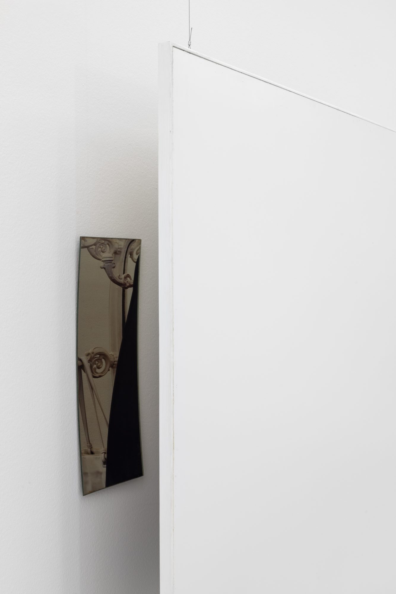 Ana Vieira, Close Up (10), 2004. White panel, photograph, mirrors, and metal cables
