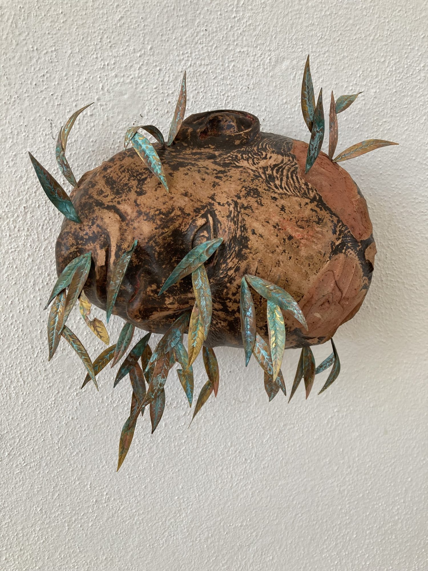 André Romão, Weeping Willow, 2026. Sculptural fragment (terracotta, France, 1970’s), brass, oxidation.
