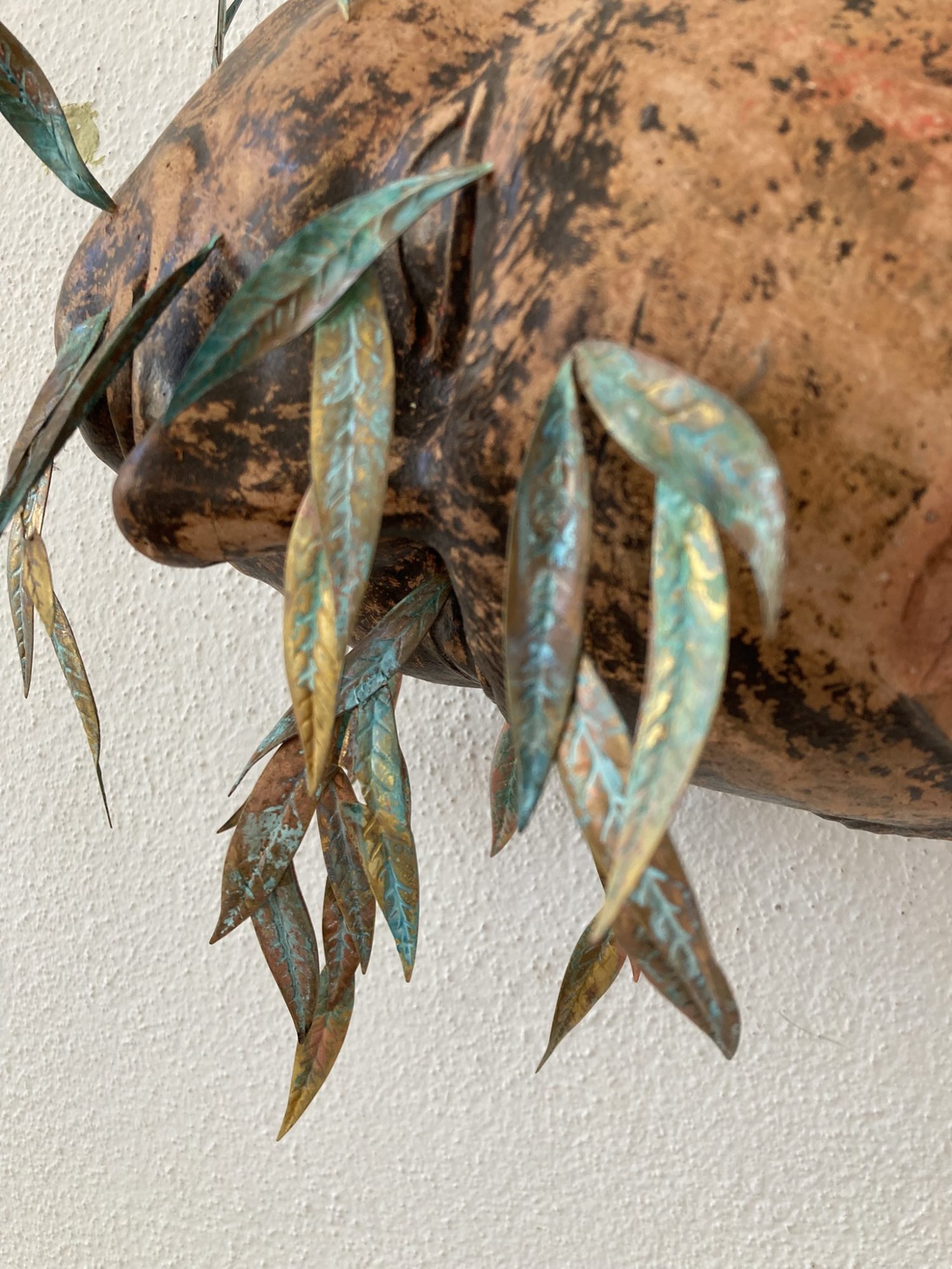 André Romão, Weeping Willow (detail), 2026. Sculptural fragment (terracotta, France, 1970’s), brass, oxidation.
